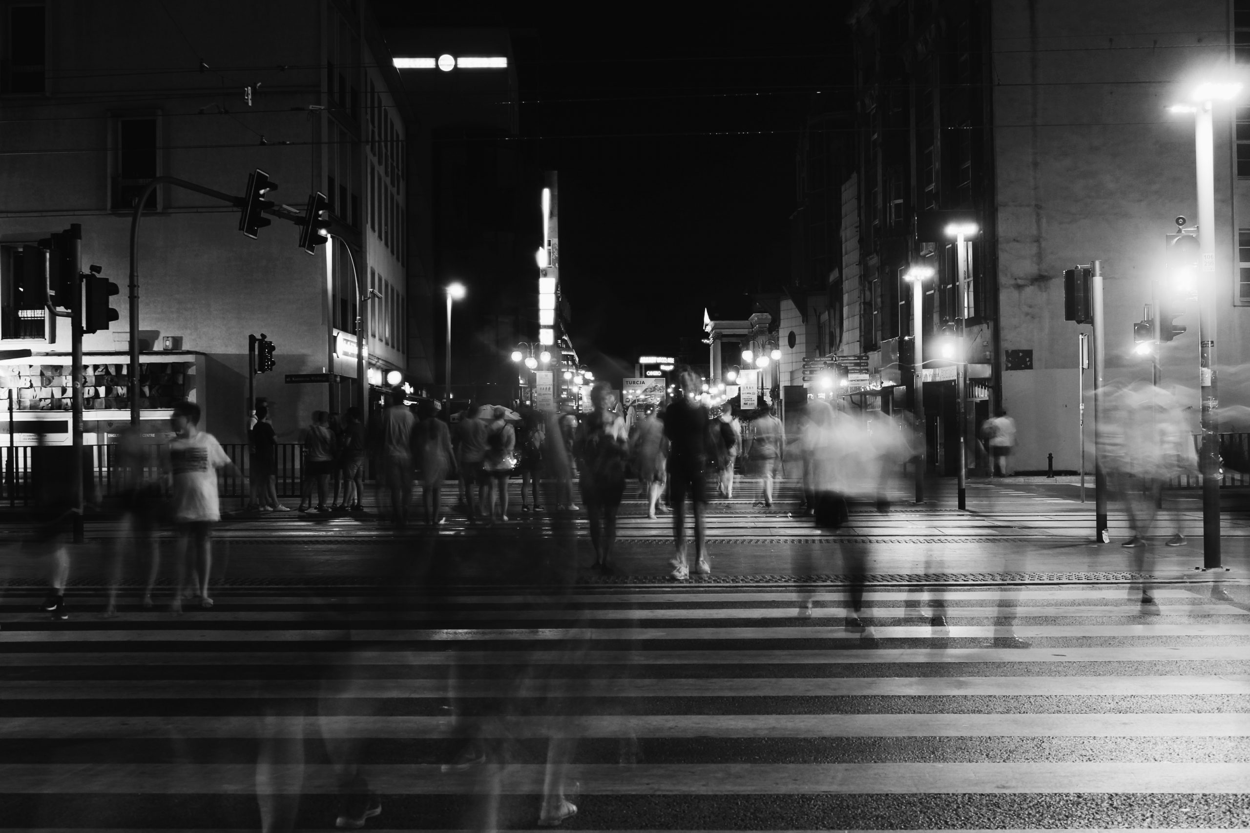 People crossing pedestrian lane.