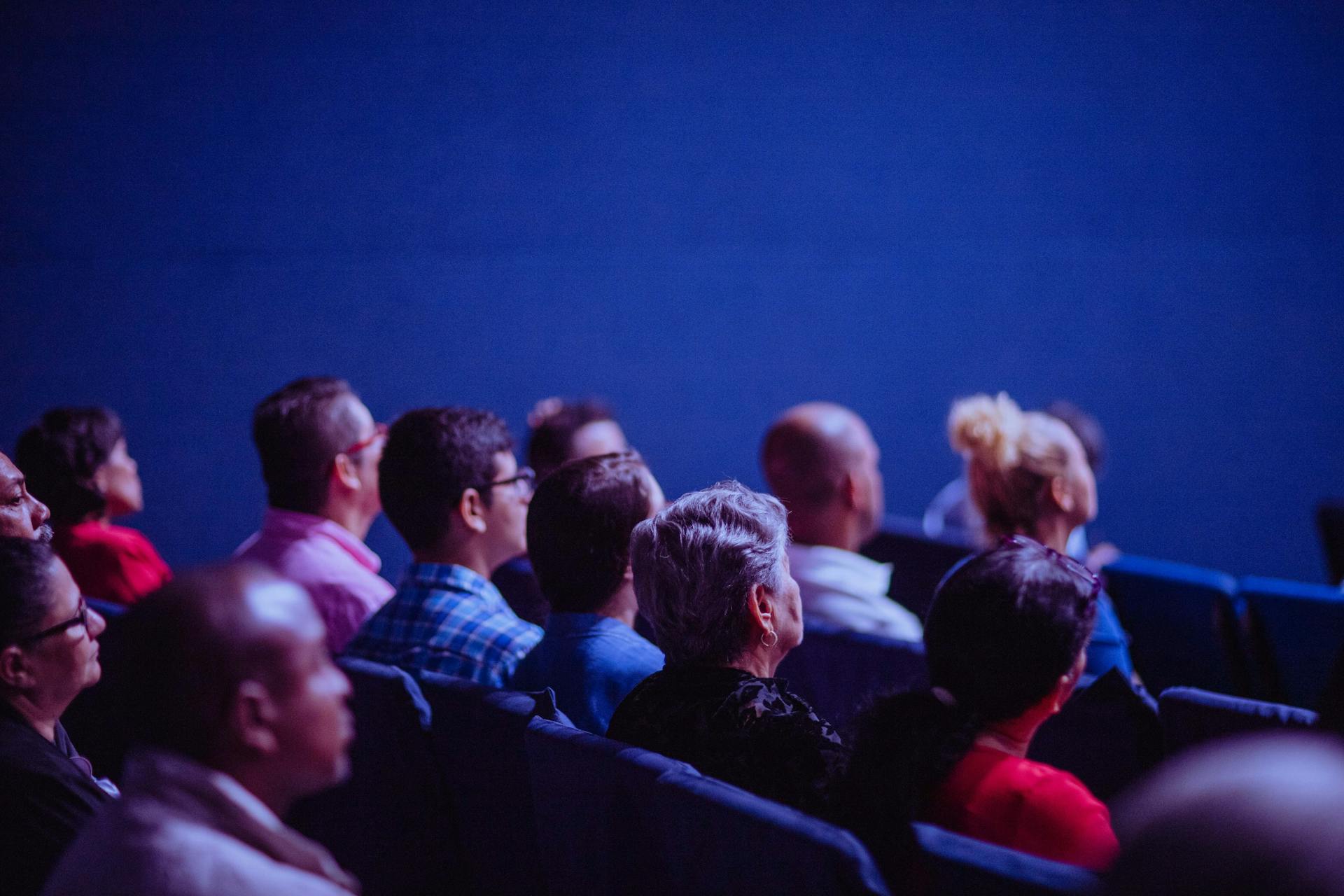 People sitting and listening to a presentation.