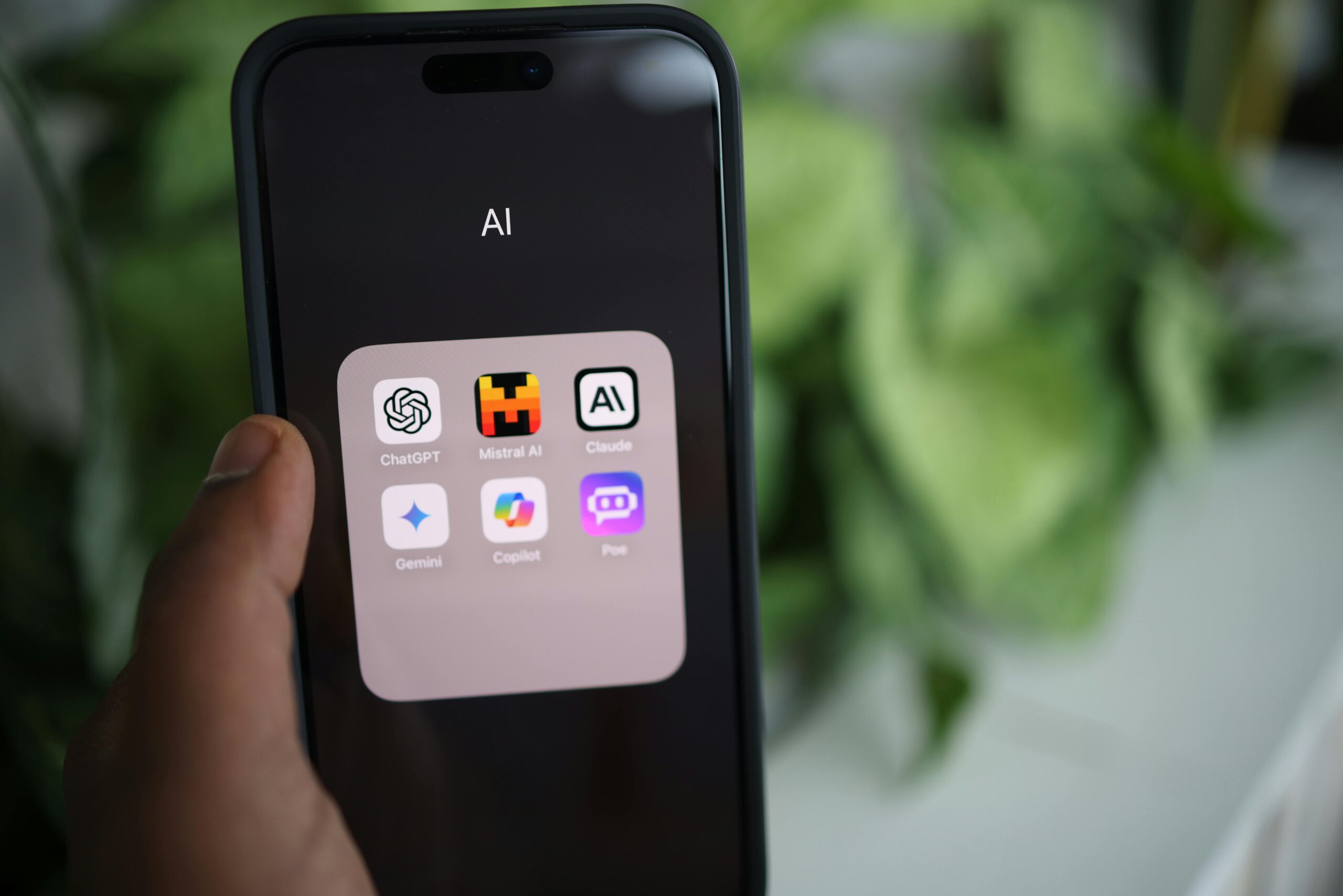 Phone screen showing AI chatbot apps.