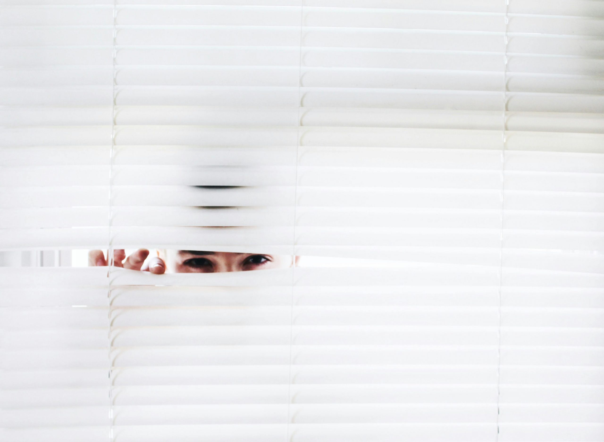 Photo of a person spying.