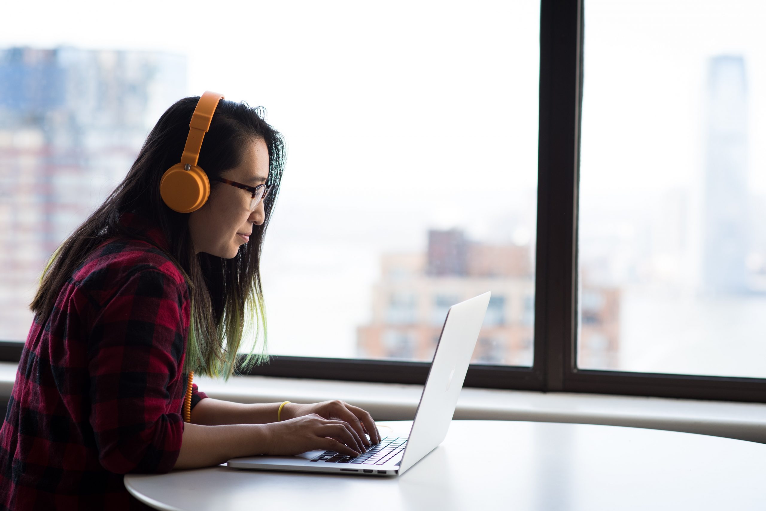 Photography of woman using laptop.